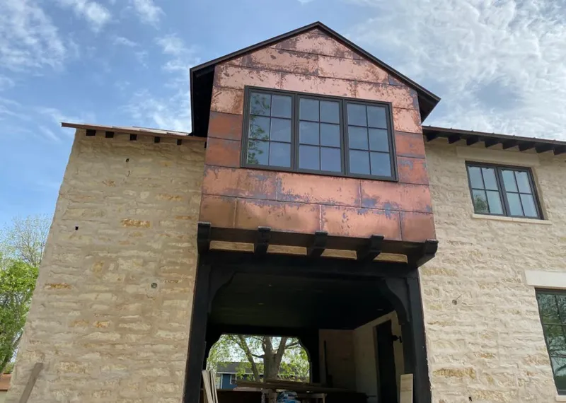 Copper metal panel facade on a stone building for Metal Roof Coating in Fort Smith